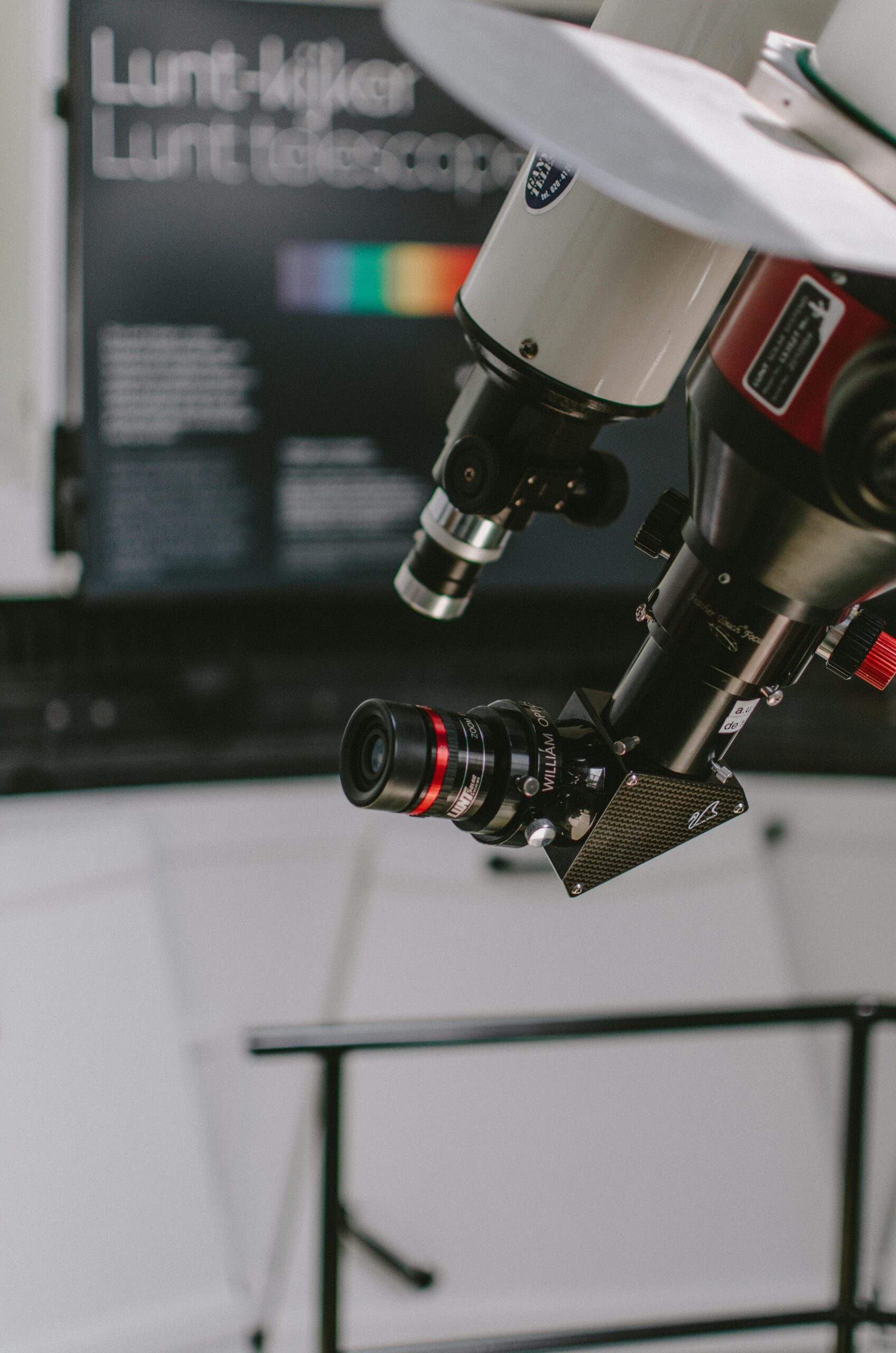 pexels-photo-2506594-2506594 Close-up of a telescope fitted with a camera in a modern laboratory setting.